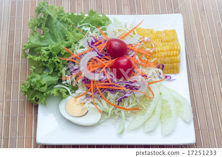 salad in the white plate on the wooden table salad in the white plate on the wooden table 17251233