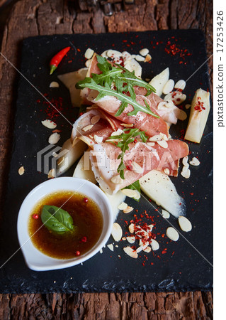salad of fresh melon with thin slices prosciutto 17253426