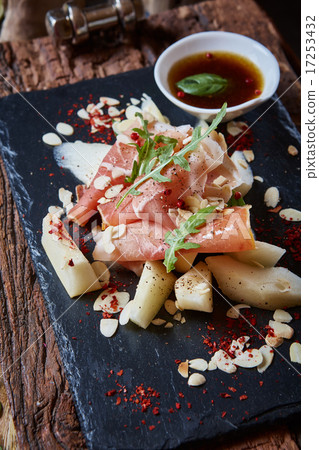 salad of fresh melon with thin slices prosciutto 17253432
