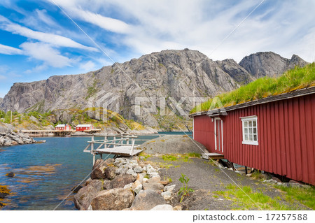 Typical red rorbu fishing hut in village Nusfjord 17257588