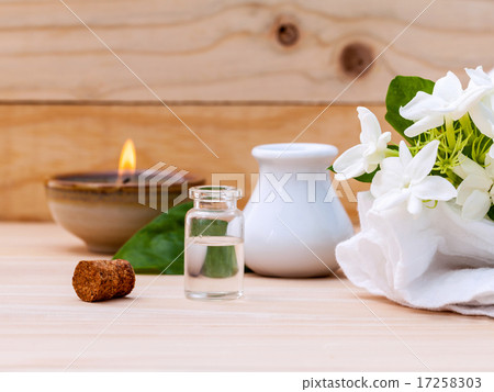 Aroma oil bottles arranged with jasmine flowers  17258303