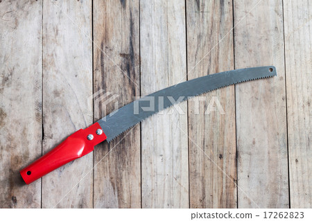 Pruning saw on wooden background 17262823