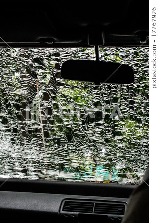 Damaged glass (car windshield) inside car 17267926