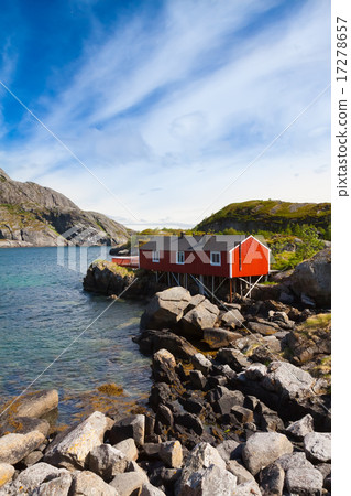Typical red rorbu fishing hut in village Nusfjord Typical red rorbu fishing hut in village Nusfjord 17278657