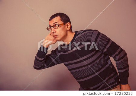 European-looking male of about thirty brunet put his hand to his 17280233