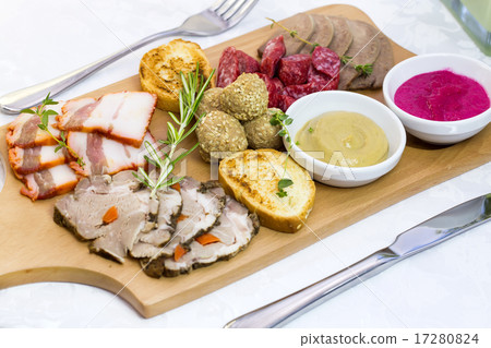 wooden dish with bacon and sausage on a white back wooden dish with bacon and sausage on a white back 17280824