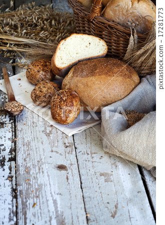 fresh bread and wheat on the wooden table fresh bread and wheat on the wooden table 17281773