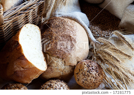 fresh bread and wheat on the wooden table fresh bread and wheat on the wooden table 17281775