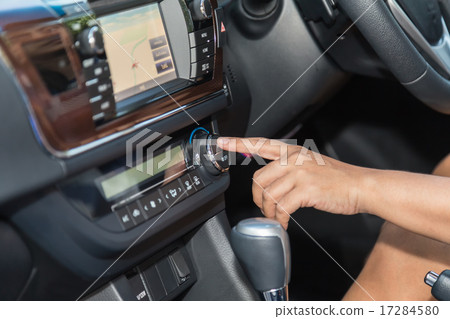 Driver hand press air-con button in the car Driver hand press air-con button in the car 17284580