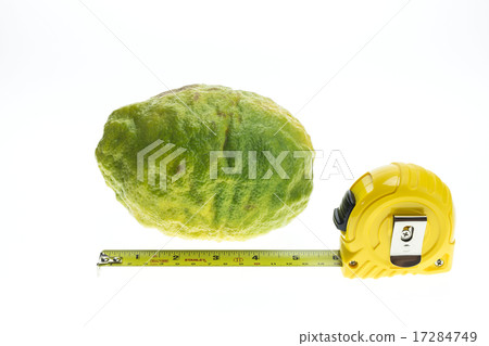 Big Thai green lemon with measuring tape isolated on white 17284749