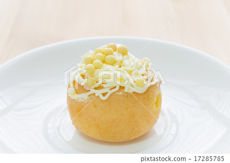 Yellow Choux or Profiterole or Eclair on Wood Desk 17285785