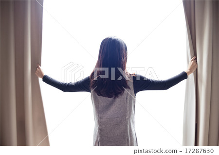 Asian portrait beautiful woman opening curtains Asian portrait beautiful woman opening curtains 17287630