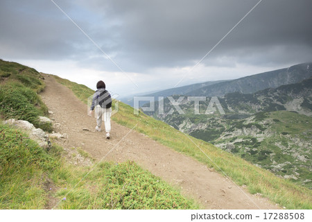 Senior woman walking in the mountain Senior woman walking in the mountain 17288508