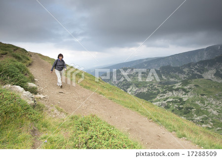 Senior woman walking in the mountain Senior woman walking in the mountain 17288509