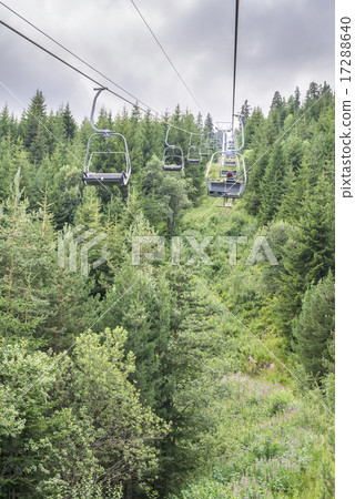 Lift in the mountain. Fir forest. Summer time 17288640