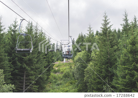 Lift in the mountain. Fir forest. Summer time 17288642