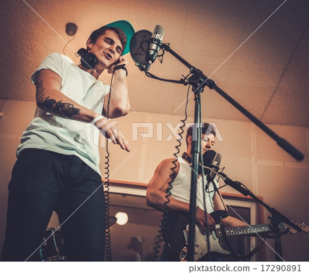 Music band performing in a recording studio Music band performing in a recording studio 17290891