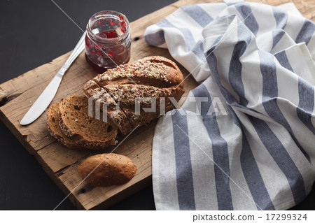 Dark multigrain bread whole grain jam fresh baked  17299324