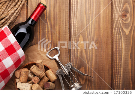 Red wine bottle, corks and corkscrew Red wine bottle, corks and corkscrew 17300336