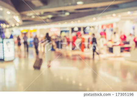 Blurred image of people in shopping mall with bokeh Blurred image of people in shopping mall with bokeh 17305196