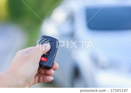 Woman hand holding key of new car 17305197