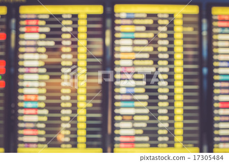 Blurred image of departures display board at airport 17305484
