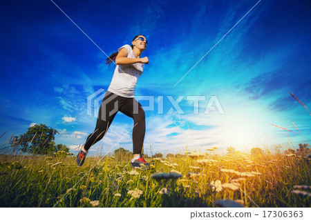 Young woman jogging in nature 17306363