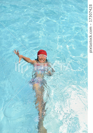 Girls playing in the pool 17307428
