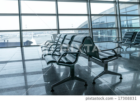 airport waiting area , seats and outside the window scene 17308831
