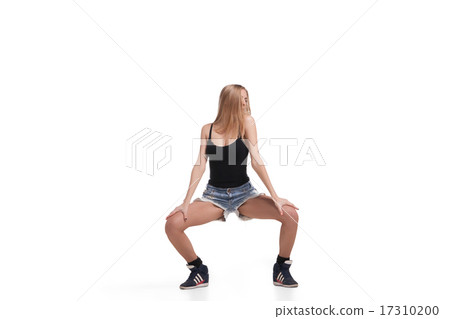 Young beautiful dancer posing on studio background Young beautiful dancer posing on studio background 17310200