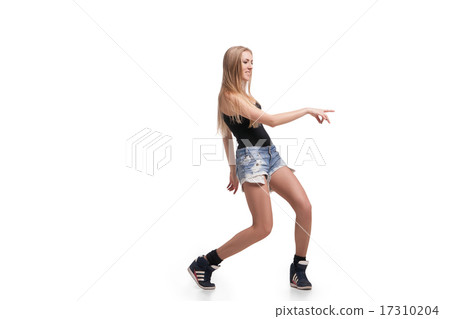 Young beautiful dancer posing on studio background 17310204