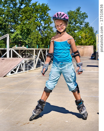 Girl riding on roller skates . Girl riding on roller skates . 17310636