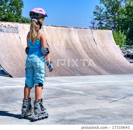 Girl riding on roller skates . Girl riding on roller skates . 17310643