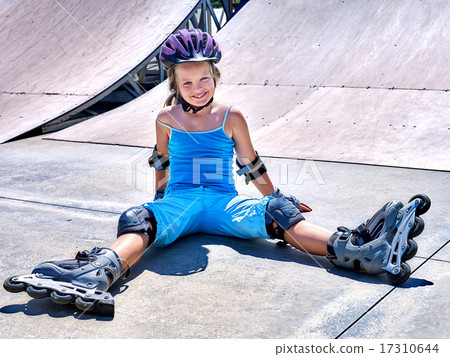 Girl riding on roller skates . Girl riding on roller skates . 17310644