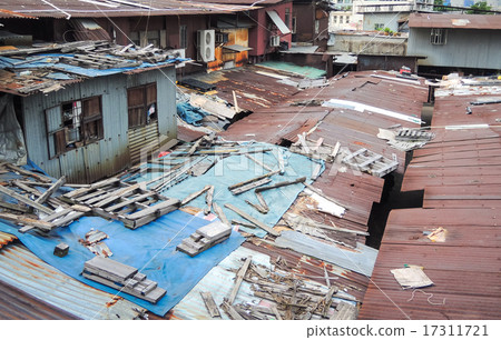 Old dirty rooftop house with messy wooden sticks Old dirty rooftop house with messy wooden sticks 17311721