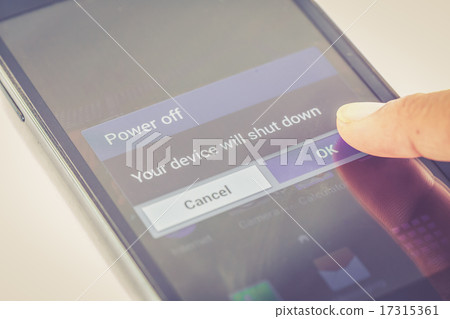 finger press power off button on smartphone 17315361