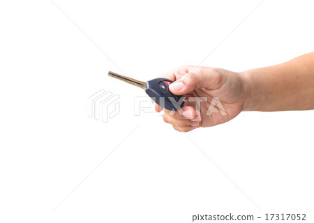Hand holding car key Hand holding car key 17317052