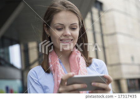 Happy Businesswoman using her smart phone. Happy Businesswoman using her smart phone. 17317435