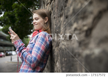 Happy woman using a Smart Phone device. 17317572