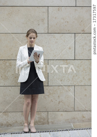 Caucasian Businesswoman with a tablet computer. Caucasian Businesswoman with a tablet computer. 17317597