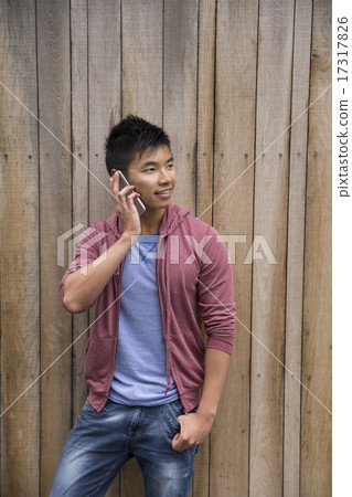 Asian Man using Smart Phone outdoors. Asian Man using Smart Phone outdoors. 17317826