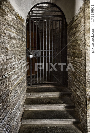 old door made of steel grating in the stone wall old door made of steel grating in the stone wall 17319901