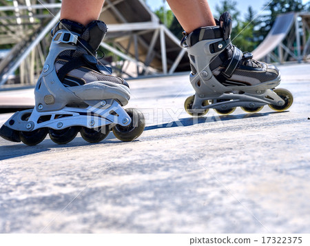 Girl riding on roller skates . Girl riding on roller skates . 17322375