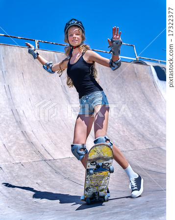Teen girl rides his skateboard Teen girl rides his skateboard 17322377