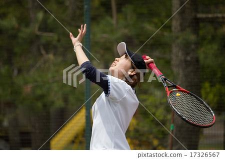 A woman playing tennis 17326567