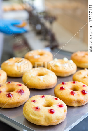 doughnuts with assorted filling on metal tray 17327151