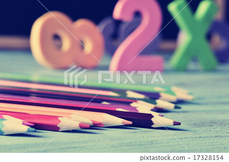 pencil crayons, and numbers on a blue wooden table 17328154