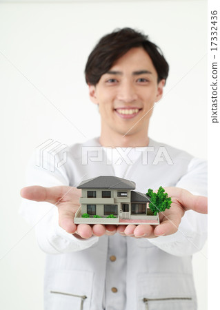 Construction worker having a house Construction worker having a house 17332436
