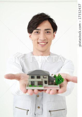 Construction worker having a house Construction worker having a house 17332437