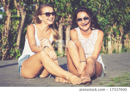Pretty beautiful brunette and blonde girl friends in sunglasses 17337600